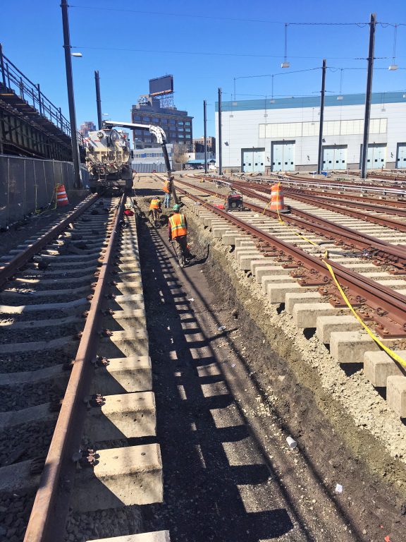 Vacuum track excavation of material between tracks in Mid Day Storage Yard for future conduit installation 04-19-19